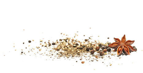 Black ground and grains pepper, crushed pile, with star anise isolated on white background, side...