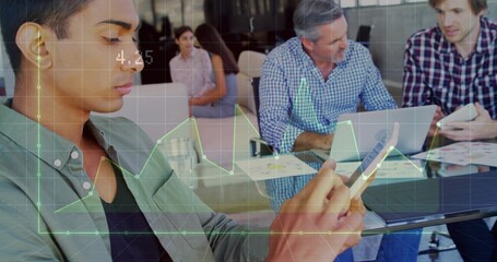 Checking smartphone, left man in blazer reviewing charts at glass table with laptop, copy space