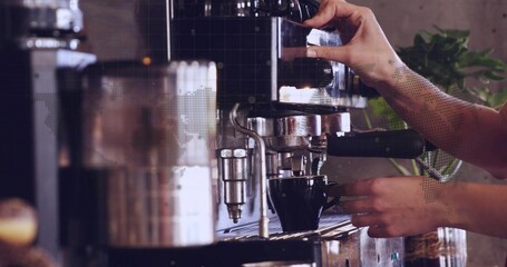 Pulling portafilter, barista hands with rolled sleeves steadying cup at cafe, with espresso machine