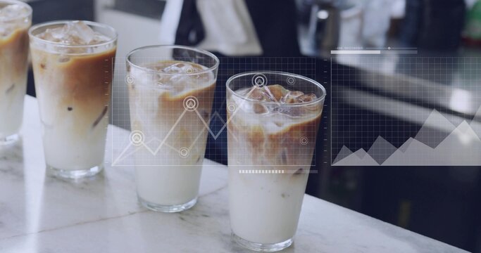 Showing 3 clear glasses layering iced latte on marble cafe counter, digital charts, staff in jacket - Powered by Adobe