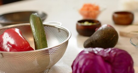 Camera zooming and panning revealing purple cabbage on cutting board with knife waiting for slicing - Powered by Adobe