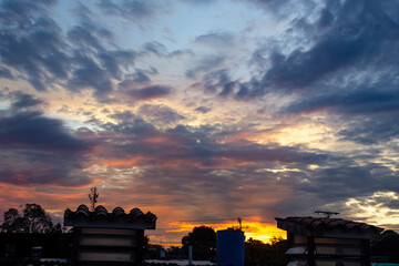 Obraz premium Sunset in the city. Colorful sky with clouds at sunset.