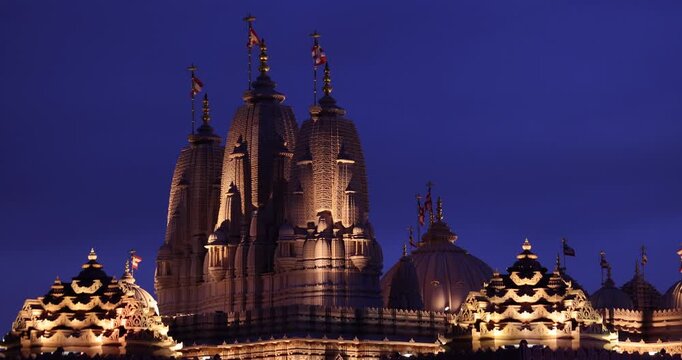 Chino Hills, California, USA - March 1, 2025: Artifical lights illuminate the Hindu temple towers of BAPS Shri Swaminarayan Mandir.