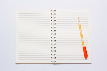 Notebook and pen placed on a white background