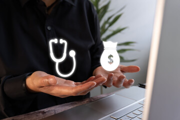 Person in front of a computer with outstretched hands and icons of a stethoscope and a bag of money. Concept of medical payments.