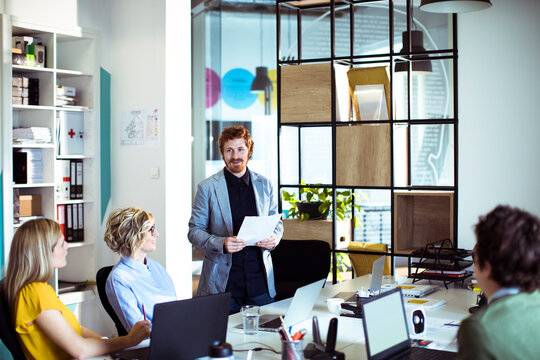 Team meeting with presenter in modern office