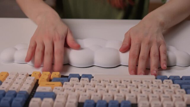 Keyboard setup showcase, Ergonomic mechanical keyboard display, Closeup of tactile switches on custom keyboard, Designer testing pastel keycaps with ergonomic wrist cushion setup