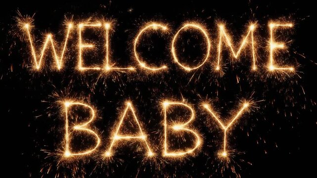 Welcome Baby written in sparklers against a black background.