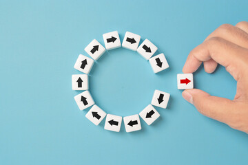 Disruption and technology transformation concept , Hand move out red arrow on dice move out from circle black arrow on blue background