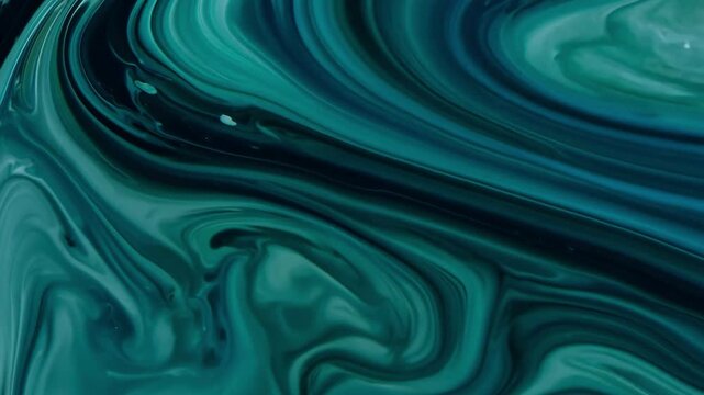 Deep emerald and teal acrylic paint mixing in slow swirls. Moody organic fluid art background.