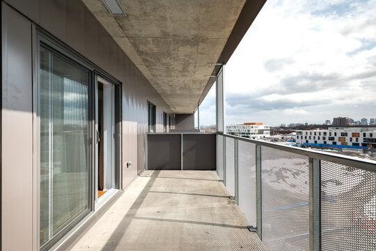 High-quality photo set of a contemporary urban apartment highlighting modern architecture, minimalist interior design, and functional living spaces. The series includes exterior facade, building entra