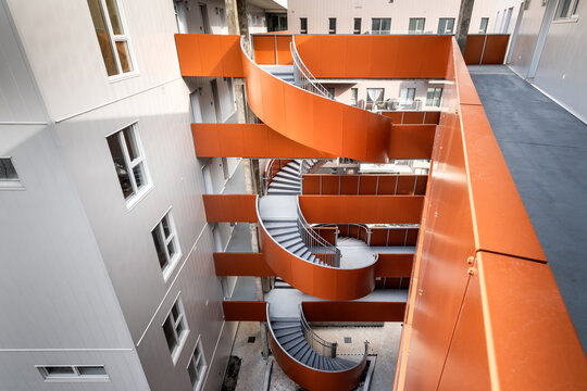 High-quality photo set of a contemporary urban apartment highlighting modern architecture, minimalist interior design, and functional living spaces. The series includes exterior facade, building entra