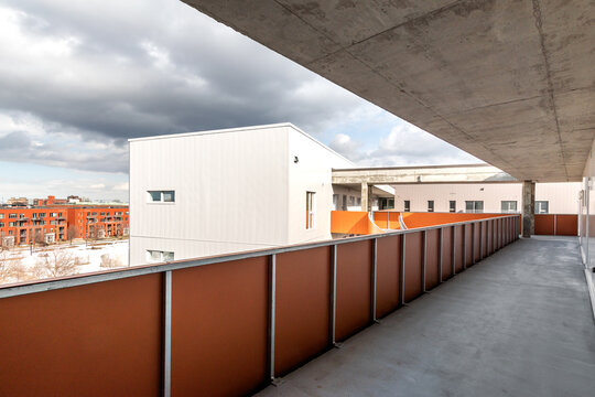 High-quality photo set of a contemporary urban apartment highlighting modern architecture, minimalist interior design, and functional living spaces. The series includes exterior facade, building entra