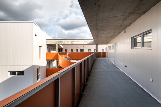 High-quality photo set of a contemporary urban apartment highlighting modern architecture, minimalist interior design, and functional living spaces. The series includes exterior facade, building entra