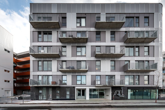 High-quality photo set of a contemporary urban apartment highlighting modern architecture, minimalist interior design, and functional living spaces. The series includes exterior facade, building entra