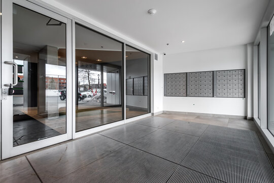 High-quality photo set of a contemporary urban apartment highlighting modern architecture, minimalist interior design, and functional living spaces. The series includes exterior facade, building entra