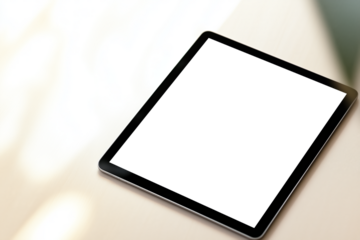 tablet with blank screen on a minimalist table, top view