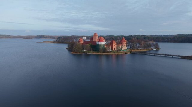 Trakai Island Castle Traku Pilis In Lithuania Aerial Trakai Island Castle Over Lake Calm Blue Water Historic Red Roofs Drone Pilot Capturing Peaceful Solitude Cinematic Establishing Shot