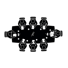 Overhead view of a business meeting with people seated around a conference table.