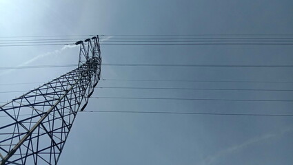 Towering Electricity Pylon Against a Clear Blue Sky