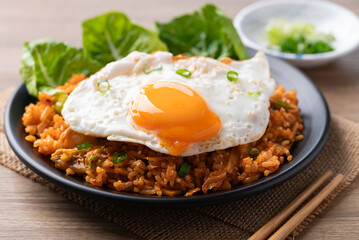 Korean kimchi fried rice with fried egg and spring onion on top