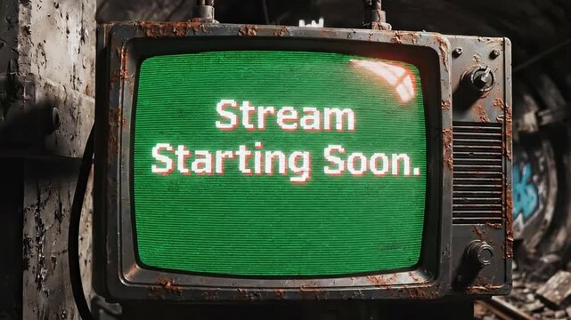 "Stream Starting Soon" on Retro Green Screen TV. Vintage CRT Monitor in Grunge Industrial Setting.