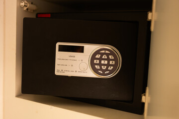 Open safe in a wealthy house. Safety box in hotel room. Concept safe storage of money and documents