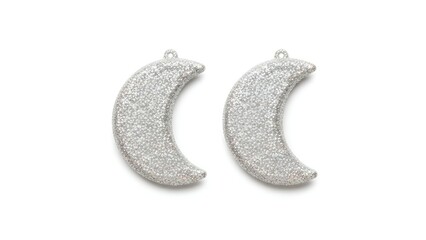 Two glittered crescent ornaments displayed side by side, isolated ornament decoration luxury