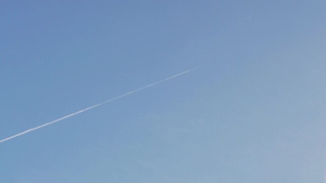 Fighter Jet Smoke Trail in Clear Blue Sky