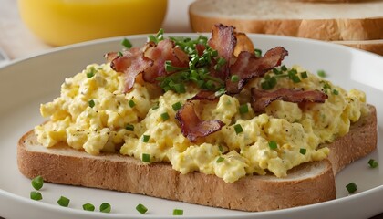 scrambled eggs and bacon on toast garnished with fresh chopped chives and black pepper