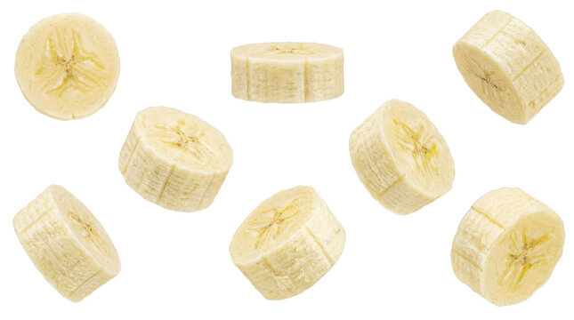 banana slices, including a full circle and several rounds, artfully arranged against a clean, dark backdrop.