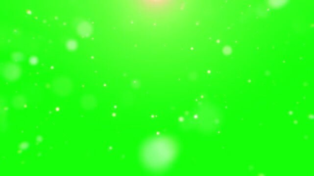 Abstract digital animation featuring floating bright white particles and subtle lens flare effects against a vivid chroma key green screen background for easy editing