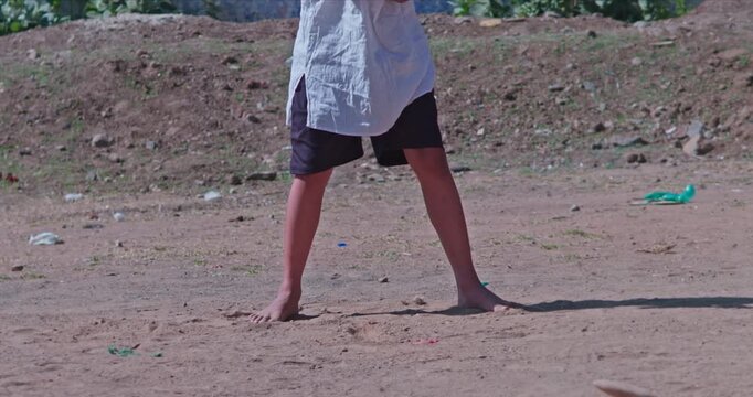 Traditional Indian Game Gilli Danda Played by Village Girl