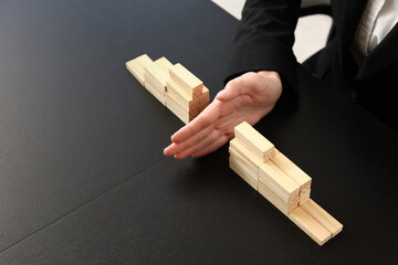 Mediator separating blocks on table in office, closeup