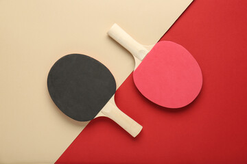 Different ping pong rackets on color background