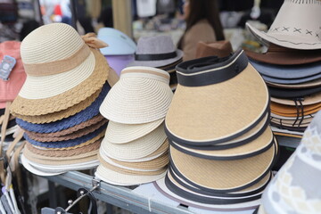 Vibrant outdoor market display of stylish sun hats for summer