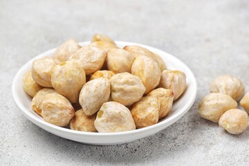 Fototapeta premium candlenut also known as kemiri, one of herbs that usually used for asian food as seasoning