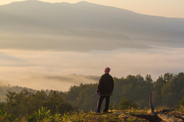 person with view sea of mist in the morning mountain