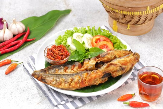Pecel lele or pecek lele or penyetan is a typical East Javanese food, consisting of catfish and tomato sauce.