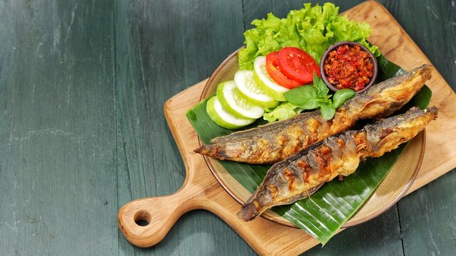 Pecel lele or pecek lele or penyetan is a typical East Javanese food, consisting of catfish and tomato sauce.