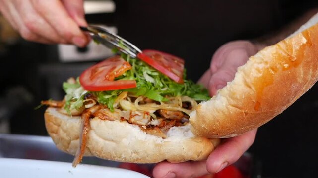 Fresh sandwich making at street food stall in the city