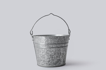 Galvanized metal bucket on grey background