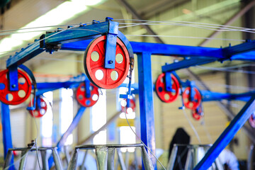 The red wheels rotating on the mechanical equipment,