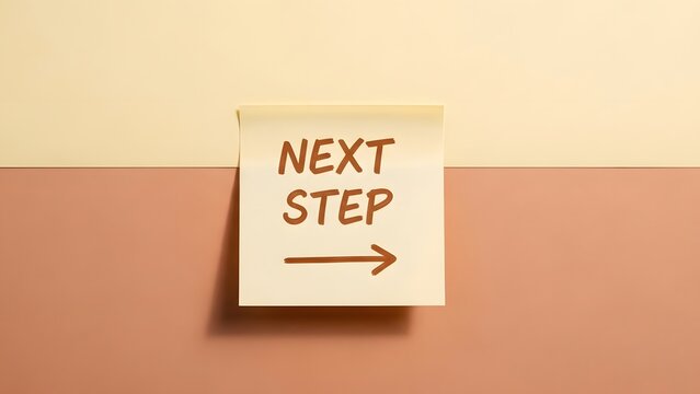 Next step message on yellow sticky note with arrow, business planning concept