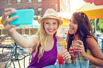 Selfie, outdoor and girl friends at restaurant for bonding, memory or social media post on...