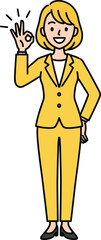 Smiling businesswoman in a yellow pantsuit making an OK hand gesture.