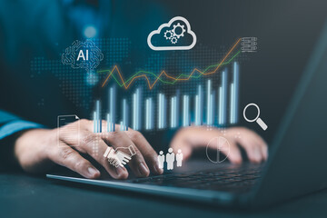 Businessman using a laptop to view analytics graphs, symbolizing business data analysis, automated BI dashboards, KPI visualization, and data-driven decision-making solutions.