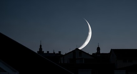 Night Sky Moon Crescent Over Rooftops in Urban Setting