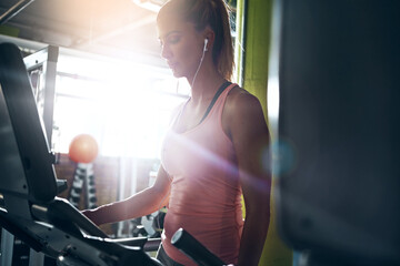 Music, fitness and woman on treadmill for workout settings, wellness and listening to audio in gym....