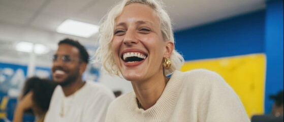 Creative young woman laughing joyfully with colleague in a vibrant modern workplace during a branding project, studio colors, and soft natural light